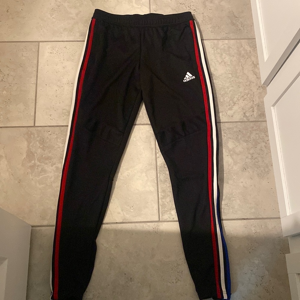 Adidas track pants . Red , White , and Blue strip on the side